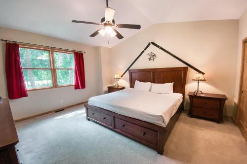 a bedroom with a bed and a ceiling fan at Northstar 1959 in Keystone