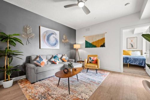 a living room with a couch and a table at Luxurious Retreat in SLC in Salt Lake City
