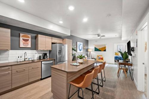 a kitchen with a table and chairs in a room at Luxurious Retreat in SLC in Salt Lake City