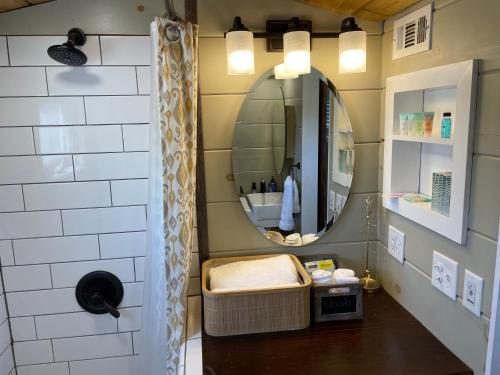 a bathroom with a sink and a mirror at TaHOW in Huntsville