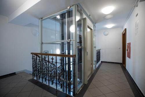 an elevator in a building with a glass door at Old Strand Spirit in Prague