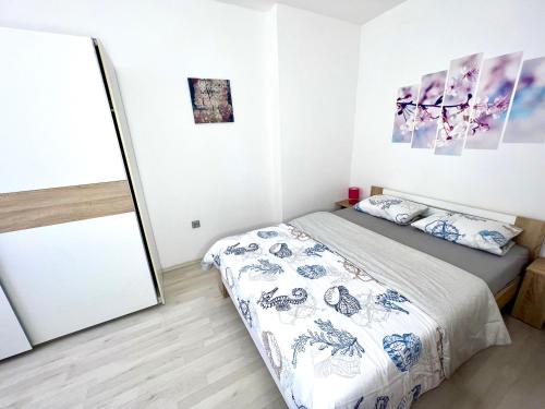 a bedroom with a bed and a mirror at Apartman Solin 3, parking in Solin