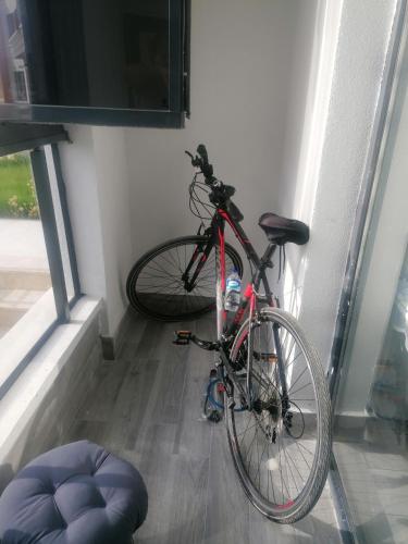 a bike parked in a room next to a window at Ankara Esenboğa Airport Luxury Apart Concept in Ankara