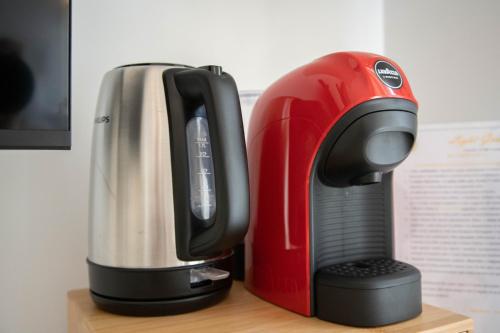 a red and black appliance sitting on a table at Light Garden in Taormina