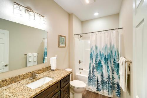 a bathroom with a sink and a toilet and a shower curtain at Quaint Harrison Home 2 Mi to Downtown! in Harrison