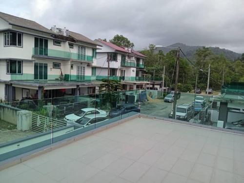 a view from the roof of a building with a parking lot at EMERALD VILLA HOMESTAY DUNGUN in Batu Lima