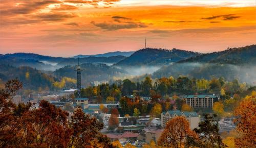 a city in the autumn with trees and mountains at Smokin Views Whispering Pines 651 in Pigeon Forge
