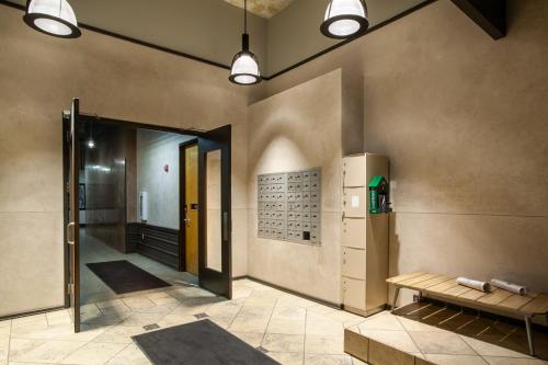 a hallway with a door and a bench in a room at Historic Downtown Loft with Modern Flare in Knoxville