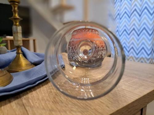 a glass vase sitting on top of a table at Lydia's cozy house in Paradeísion