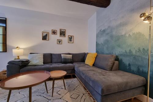 a living room with a couch and a table at La Cabane de Milo - Typical Honfleur fisherman's house - 2 bedrooms in Honfleur