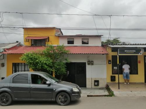 a silver car parked in front of a building at Casa lowcost relajación in La Dorada