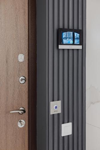 a door with a television on top of it at THE BEST APARTMENT ON THE SEASIDE IN ODESA! Luxury apartments in Arcadia, near seaside! in Odesa