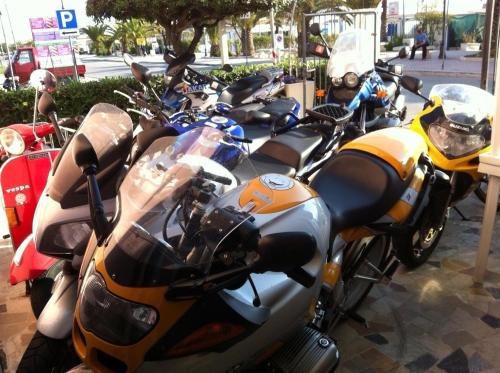 a row of motorcycles parked next to each other at Hotel Rosa Meublé in Porto San Giorgio