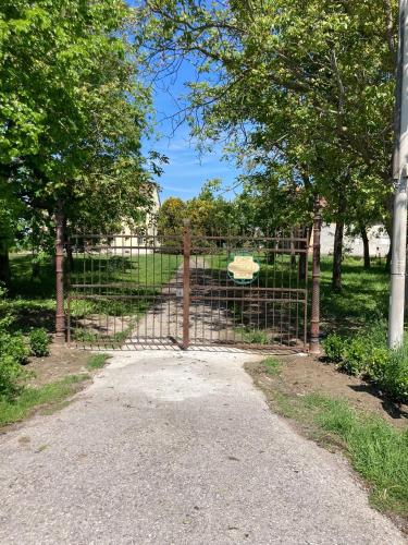 a gate in a park with trees at Corte Croce in Gonzaga