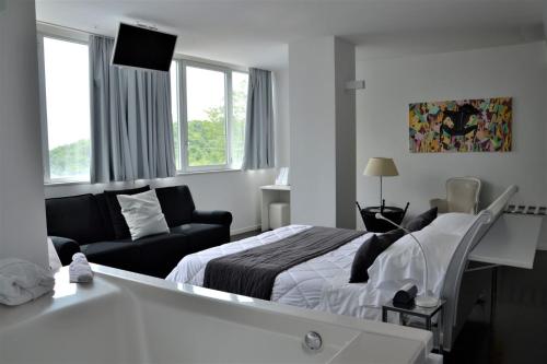 Postel nebo postele na pokoji v ubytování Hotel iDesign