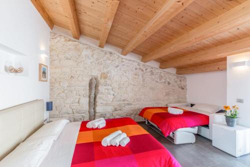 A bed or beds in a room at B&B Bianco E Blu