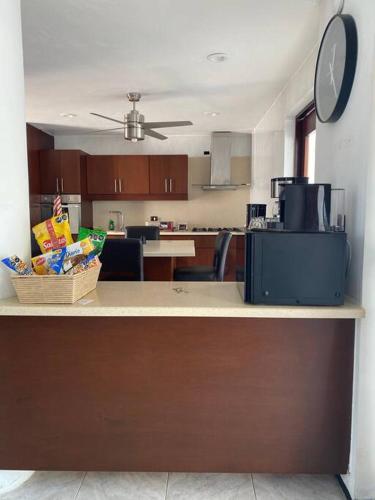 a kitchen with a counter with a counter top with a counter sidx sidx at La Casa en Celestun in Celestún