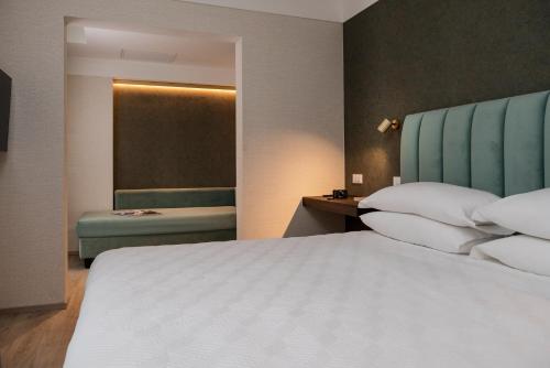 Ένα ή περισσότερα κρεβάτια σε δωμάτιο στο Hotel Sole