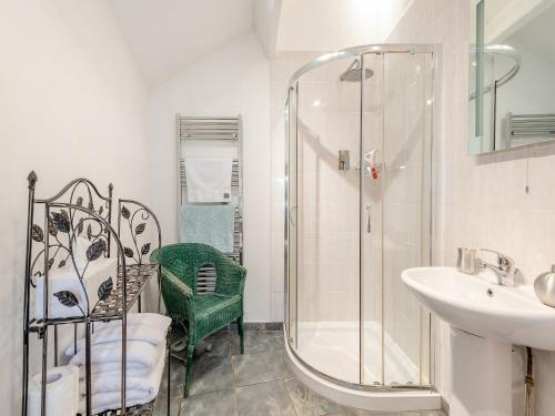 a bathroom with a shower and a sink at Hollow Creek Cottage - 28012 in Rockcliffe