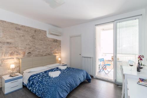 Postel nebo postele na pokoji v ubytování B&B Bianco E Blu