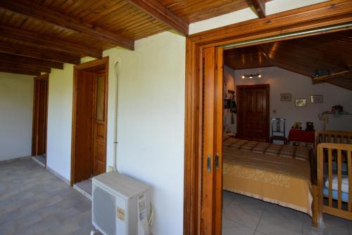 a room with a door open to a bedroom at Agios Konstantinos peaceful Beach 3bdr apartment in Agios Konstantinos Fthiotida