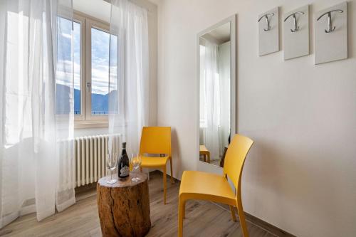 a room with two chairs and a table and a window at Casa Bepi in Tremosine Sul Garda