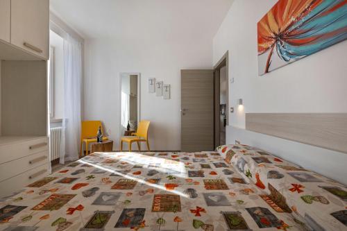 a bedroom with a bed with a quilt on it at Casa Bepi in Tremosine Sul Garda