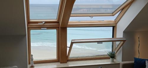 a view of the ocean from a house at VISTA MAR apartamento con encanto in Malpica