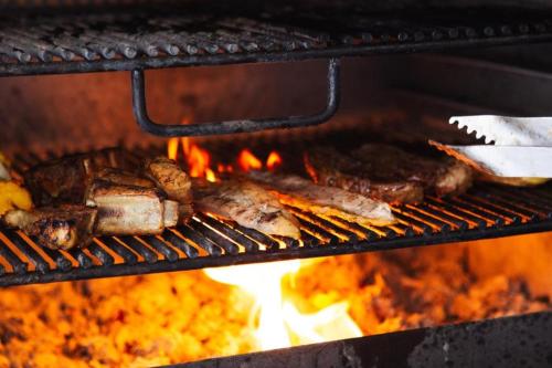 a bunch of food cooking in an oven at Hotel Hacienda Santa Clara in Santa Rosa de Cabal