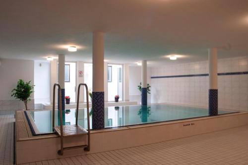 a large swimming pool in a building at Edelweiss -229- in Mittenwald