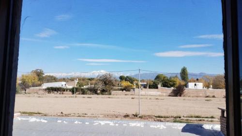 a view of a field from a window at Alquiler por día/semana in Ciudad Lujan de Cuyo