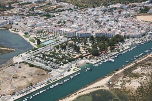an aerial view of a marina in a city at Casa da Açoteia, Fuseta in Fuzeta