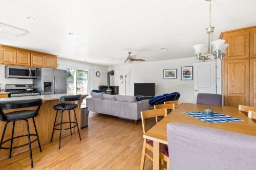 a kitchen and living room with a table and chairs at Big Creek Hideaway in Groveland