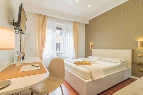 Una cama o camas en una habitación de IL VICOLO suite