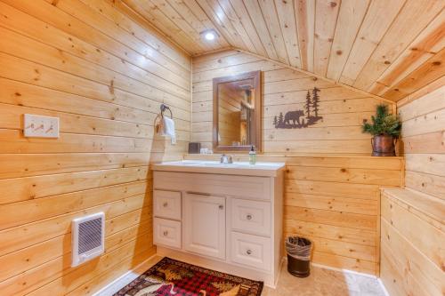 a bathroom with a sink and a mirror at John Lake Lodge in Rhododendron