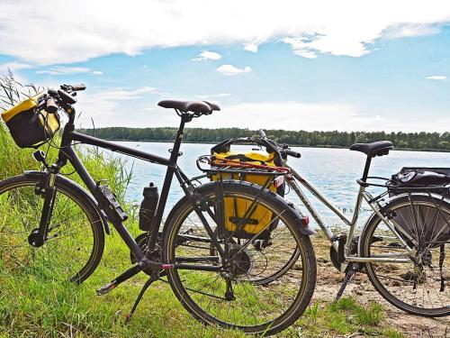 two bikes are parked next to a body of water at 6 person holiday home in RÄTTVIK-By Traum in Rättvik