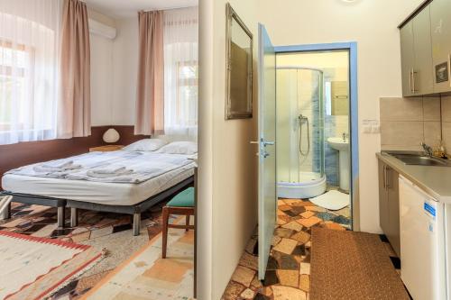 Ένα ή περισσότερα κρεβάτια σε δωμάτιο στο Apartments Villa Kobilj