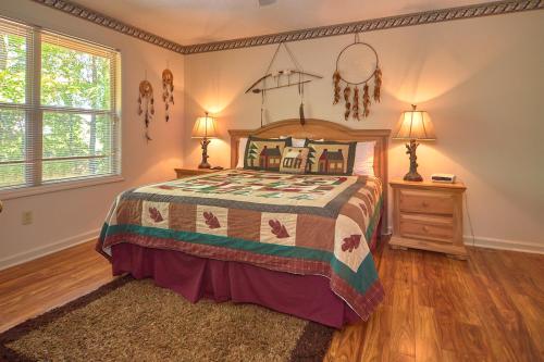a bedroom with a bed and two lamps and a night stand at Mountain Hideaway, 1 Bedroom, Sleeps 2, Wood Fireplace, WiFi, Pool Table in Gatlinburg