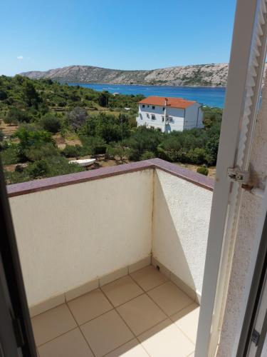 a balcony with a view of the ocean at MIRKO DIVING CENTER in Rab