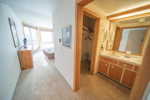 a bathroom with a sink and a mirror at Pines 2086 in Keystone
