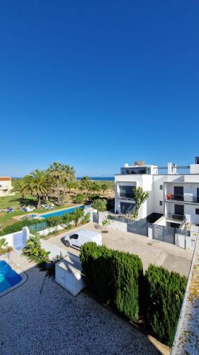 an aerial view of a resort with a swimming pool at Beachfront house,Manta Rota,Algarve in Vila Nova De Cacela
