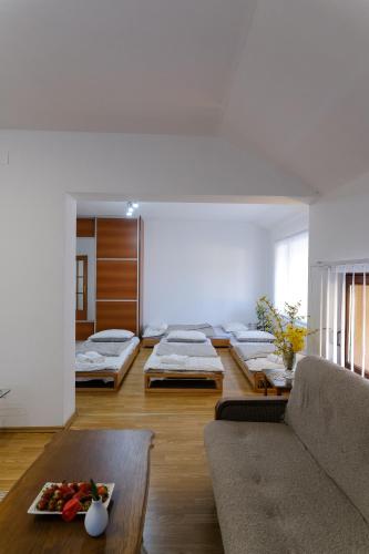 a living room with several mattresses on the floor at The Cosmic Gate Apartments in Visoko