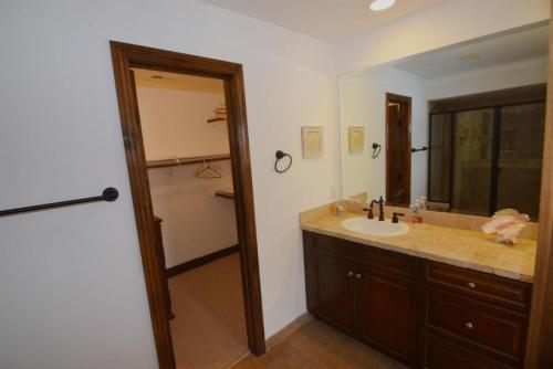 a bathroom with a sink and a large mirror at El Dorado Paradise #434 in San Felipe