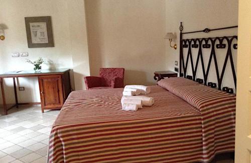 Katil atau katil-katil dalam bilik di Relais Sant'Eligio