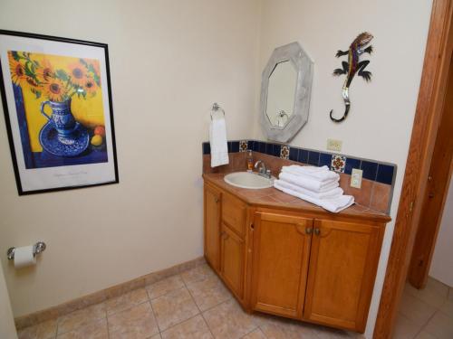 a bathroom with a sink and a mirror at CASA MAGERS - El Dorado Ranch San Felipe Rental Home in San Felipe