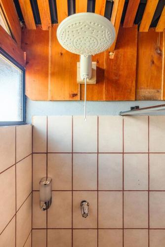 a bathroom with a light hanging from the ceiling at The Red Door Mountain Cabin in Guadalupe