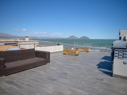 a patio with couches and a view of the ocean at La Hacienda San Felipe Mexico Vacation Rental in San Felipe