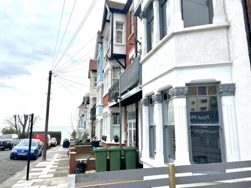 a street with a store on the side of a building at Cliffs Pavilion 2 Bedroom Apartment in Southend-on-Sea