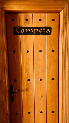 a wooden cabinet with a sign on top of it at Boutique Hostal Lorca in Nerja