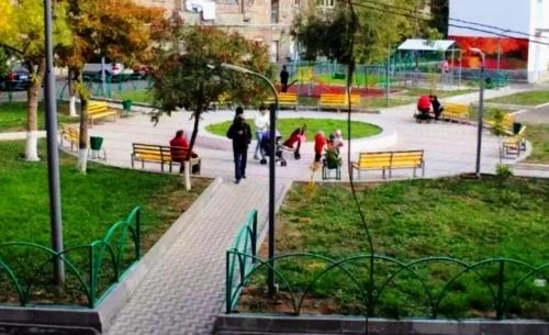 a group of people walking around a park at Apartment on Bagratuniats Street in Yerevan